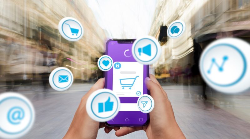 Téléphone avec application d’e-commerce et icônes numériques.