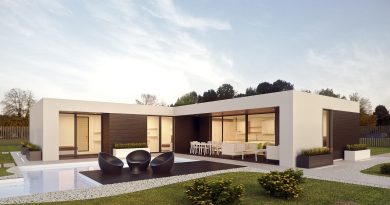 Villa moderne minimaliste avec piscine et grandes baies vitrées ou façade de maison contemporaine grise et pierre sous un ciel nuageux.