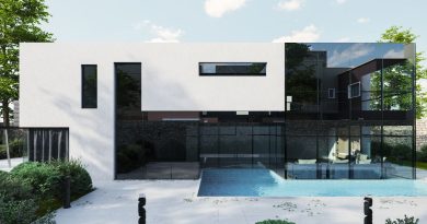 Façade d'une villa contemporaine avec piscine, terrasse claire et jardin structuré.